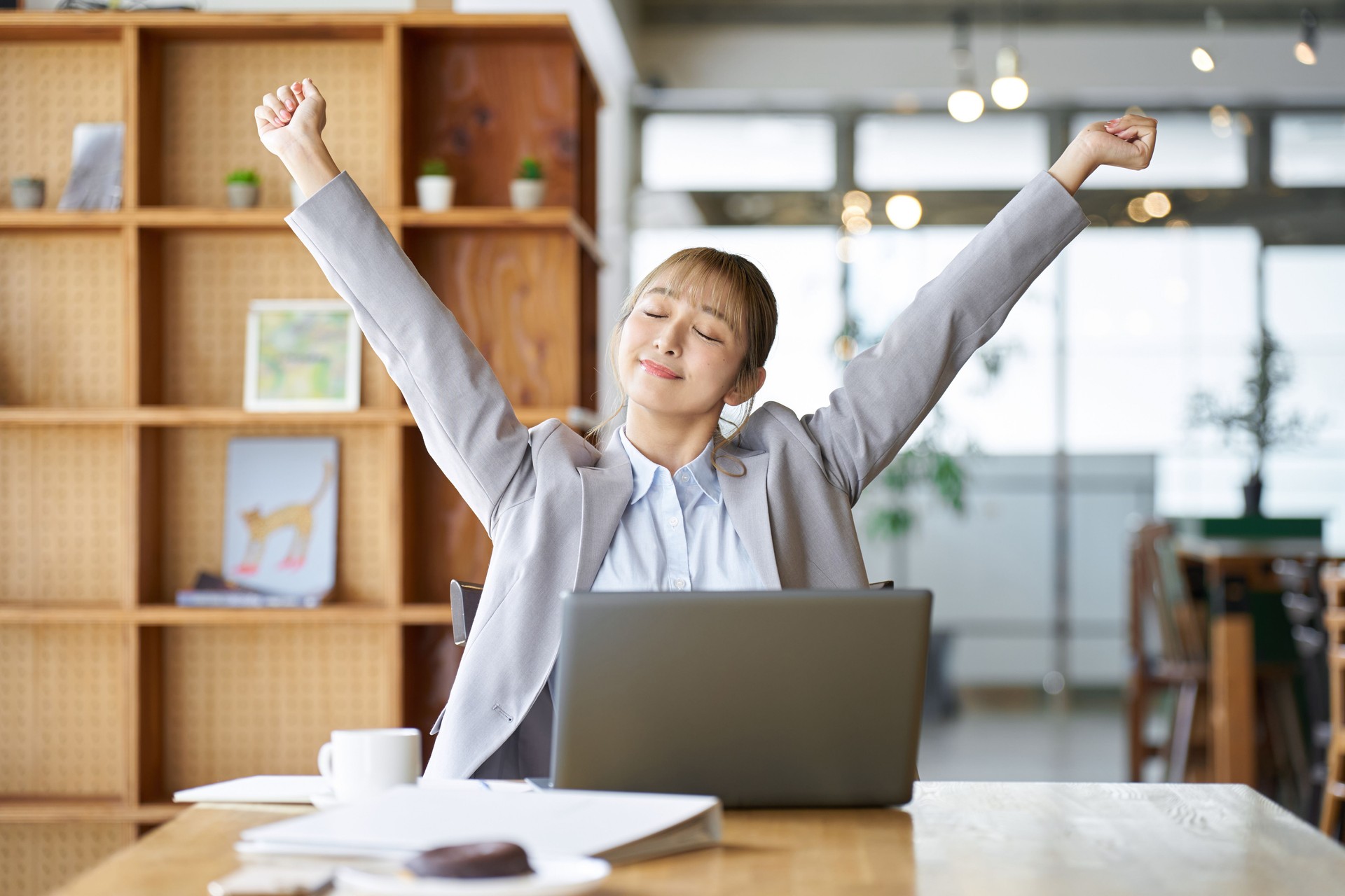 Asian woman stretching while working